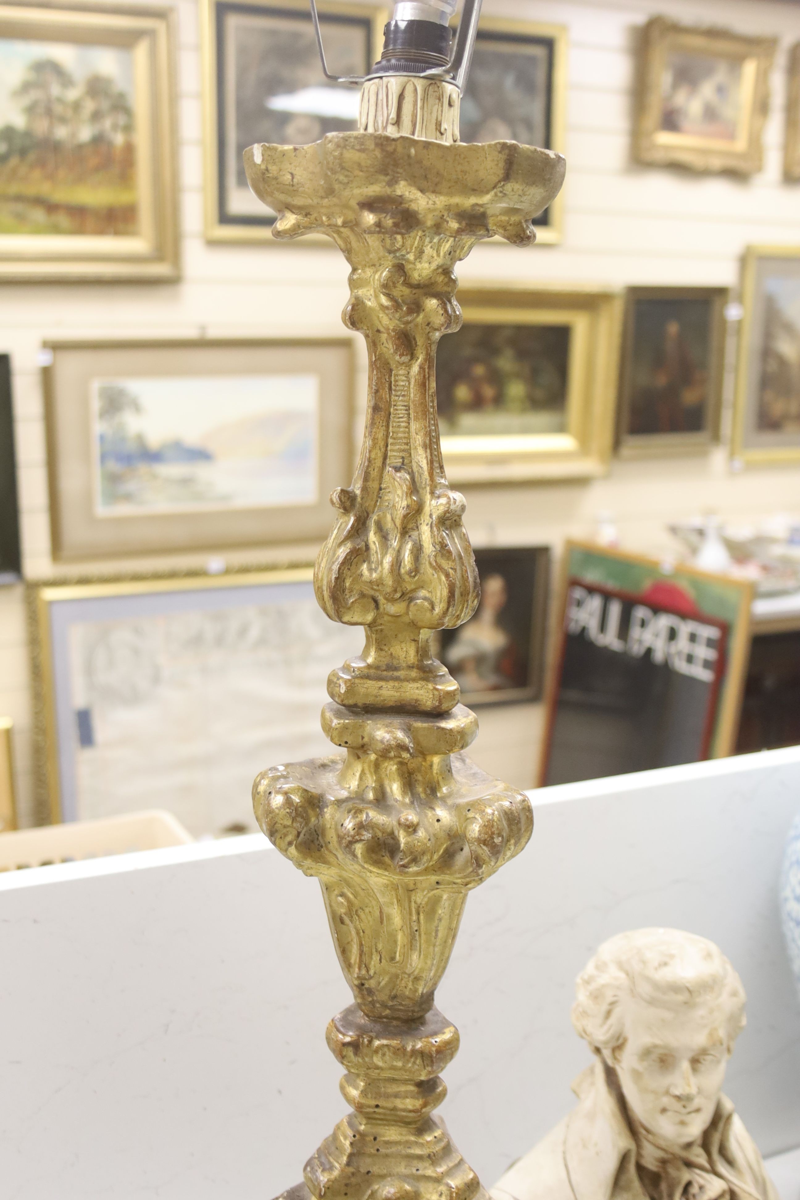 A giltwood altar candlestick as a lamp, height 71cm (excl. light fitting) and a plaster bust of Mozart